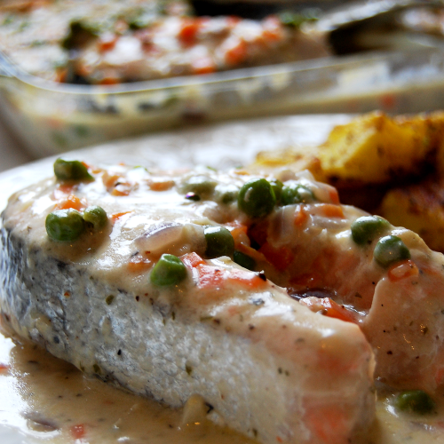 Poached salmon in a chunky white sauce